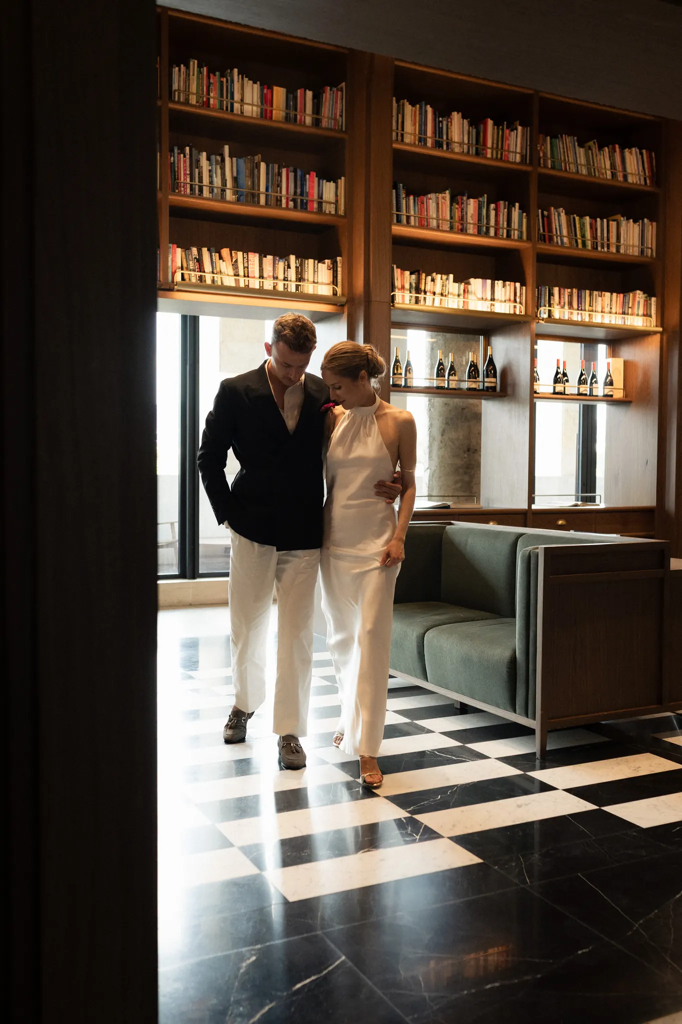 Veronika and Sasha walking through the hotel library