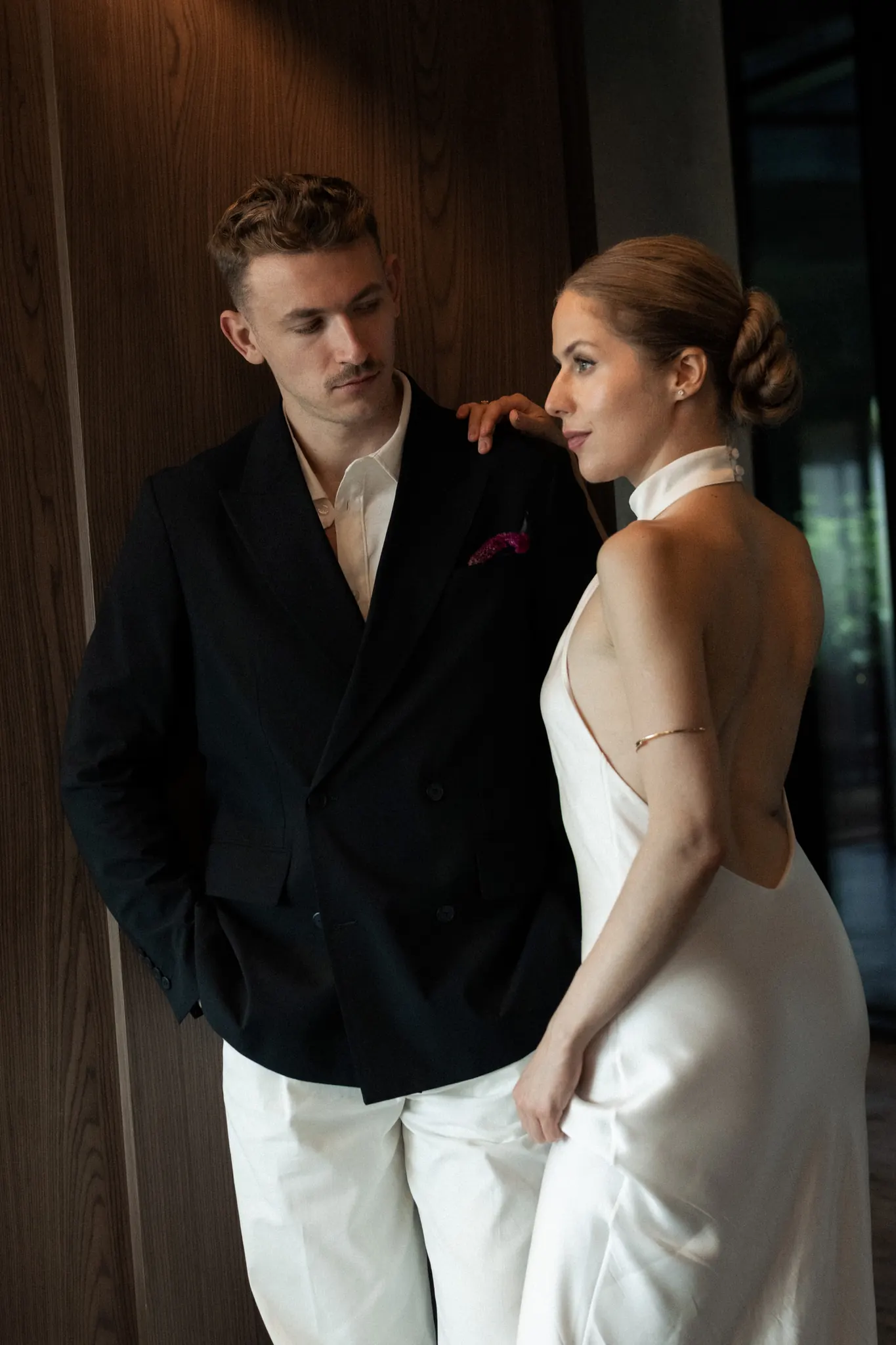 Sasha looking at Veronika, her hand on his shoulder