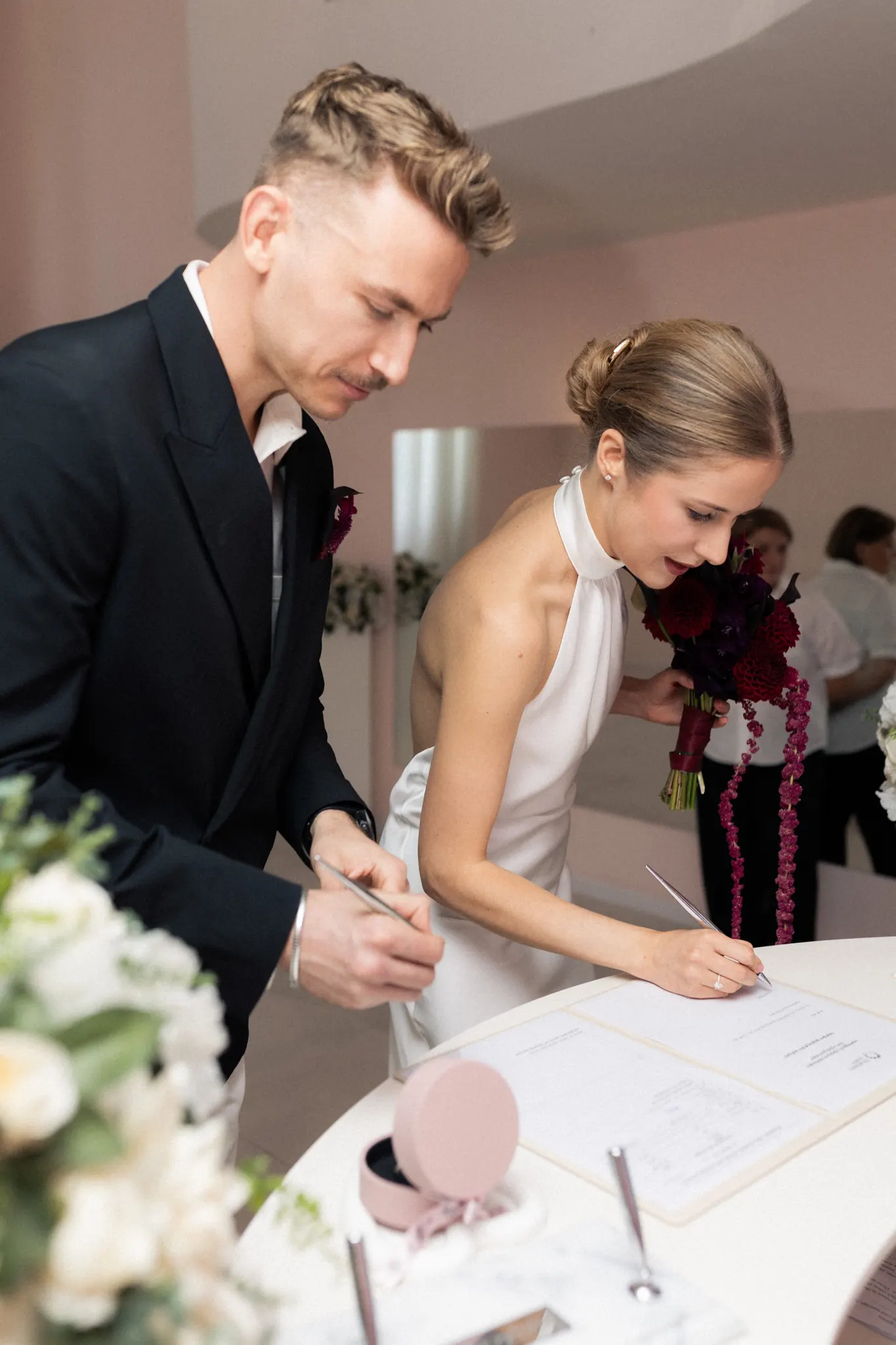 Veronika and Sasha signing the marriage register